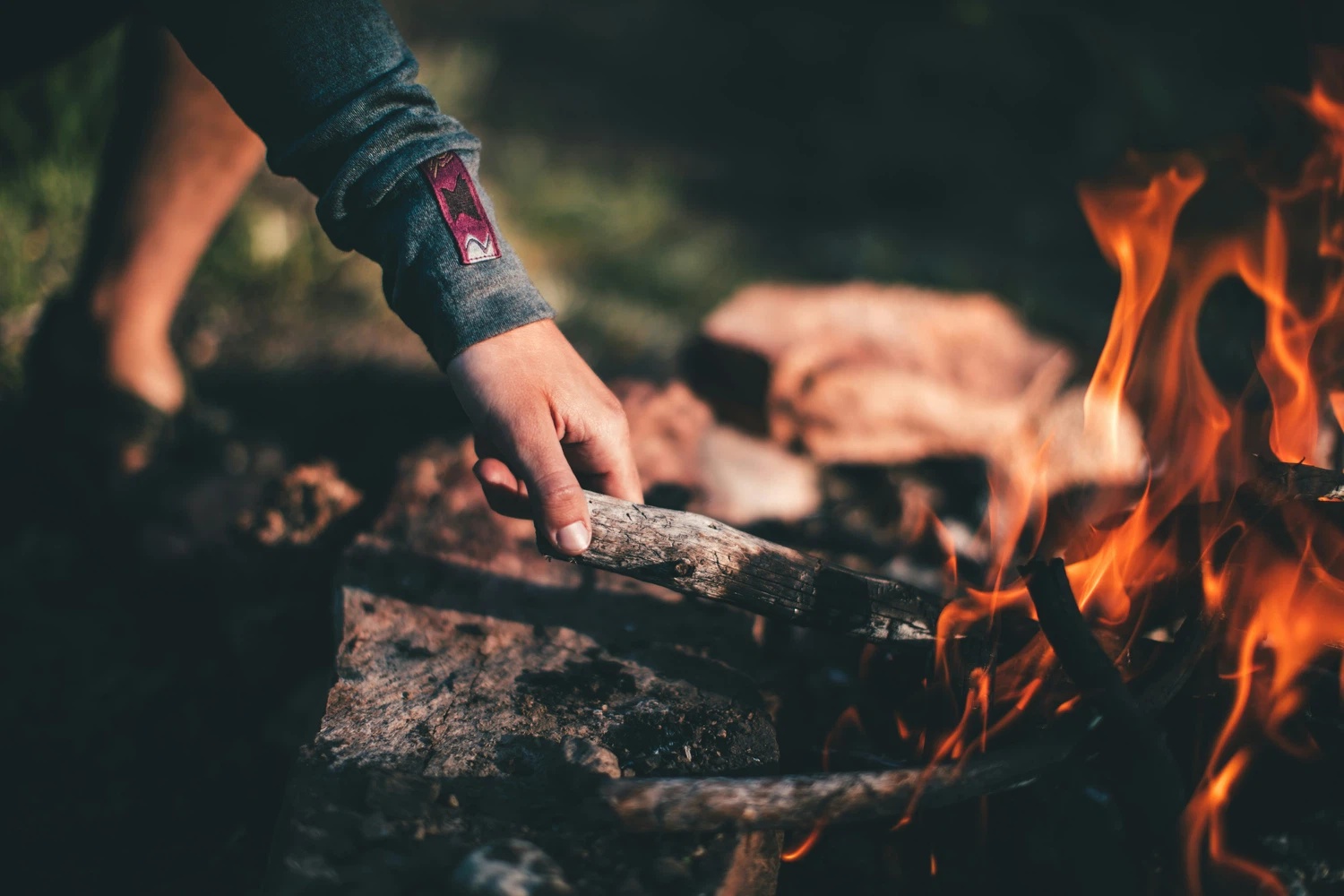 Hand flaming a fire