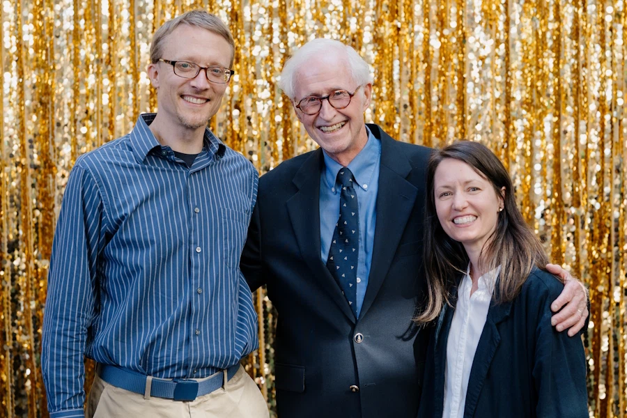 Dr. Carl Armerding poses with Old Testament faculty Matthew Lynch and Brittany Melton.